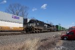 NS 4428 and 1811 take train 257 down the siding as 26X passes on main 1